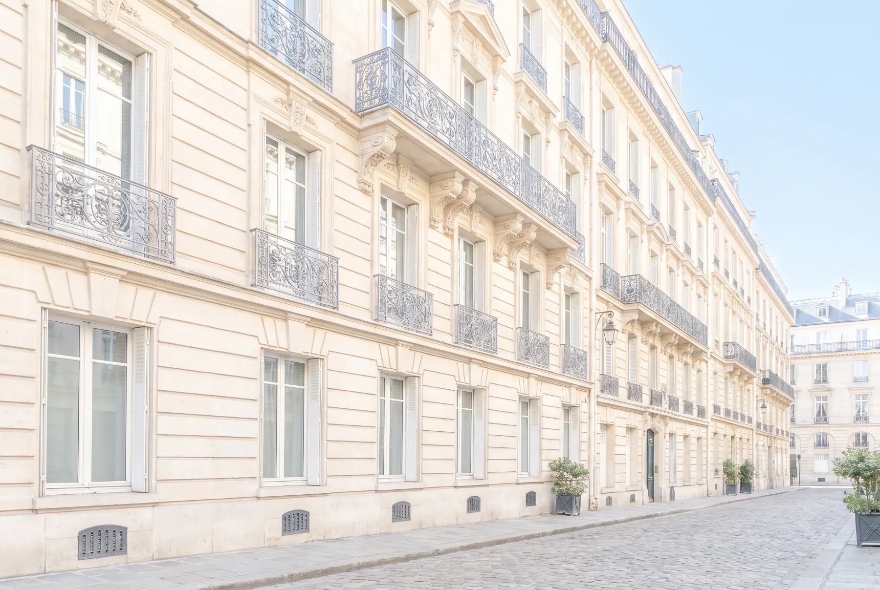 Haussmann facade on a quiet Paris street in clear morning light